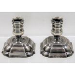 A pair of small white metal Danish taper holders 2