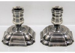 A pair of small white metal Danish taper holders 2