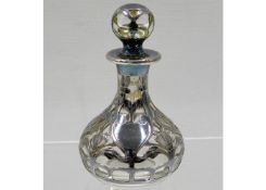A glass scent bottle with white metal overlay 3.62
