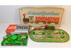 Two vintage working boxed Russian tinplate clockwo
