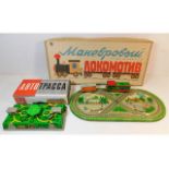 Two vintage working boxed Russian tinplate clockwo