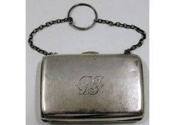 An antique white metal purse with internal textile