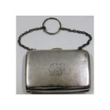 An antique white metal purse with internal textile