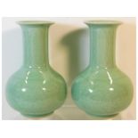 A pair of 20thC. Chinese celadon vases with chased