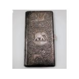 A heavy gauge Indo-Aryan silver cigarette case with elephant & lion decor, initialed to one top corn