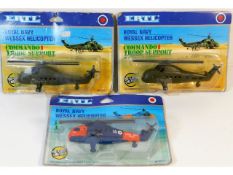Three cased Ertl helicopters, two military & one r