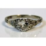 An antique 18ct white gold ring set with approx. 0.75ct old cut centre diamond (approx. 6mm x 4mm) o