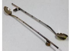 Two silver cocktail spoon straws with bucket & bir