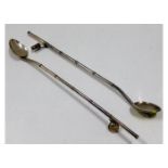 Two silver cocktail spoon straws with bucket & bir