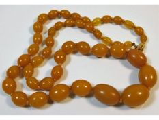 An amber style beaded necklace 26in long, 49.3g, l