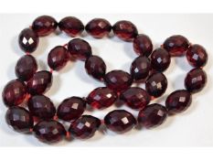 A vintage faceted cherry amber style beaded neckla