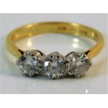 An 18ct gold trilogy ring set with approx. 1ct diamond size M/N 3g
