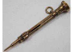 A gilt miniature self propelling pencil approx. 2.