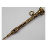 A gilt miniature self propelling pencil approx. 2.