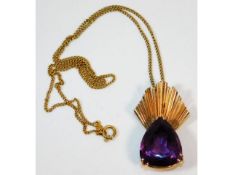 An 18ct gold mounted amethyst with 18ct gold 16.5i