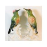 A pair of Karl Ens porcelain woodpeckers, both wit