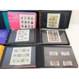 Three mint stamp albums relating to Guernsey, appr