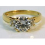 A 14ct gold trilogy ring set with paste stones, size R, 4g