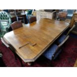 A large Victorian oak extending dining table with