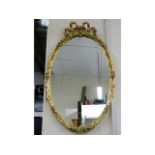 A decorative gilt framed mirror, 40in high x 24.25