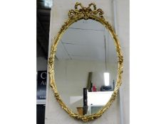 A decorative gilt framed mirror, 40in high x 24.25