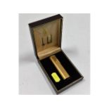 A boxed Dunhill gold plated lighter, used, some mi