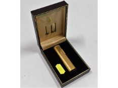 A boxed Dunhill gold plated lighter, used, some mi