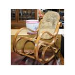 A chairs bentwood style cane rocking chair