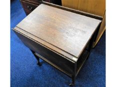 A 1920's oak tea table table on wheels, 36.25in ex