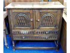 An oak credence cupboard with drawers under, 39in