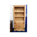 A modern pine bookcase with cupboard under, 72in t