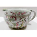 A Royal Doulton chamber pot with floral decor appr