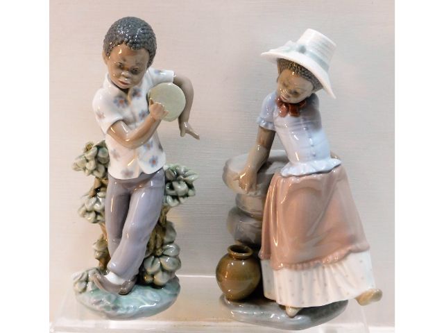 A pair of Lladro figures of children, nos. 5157 &