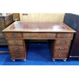 A Victorian mahogany pedestal writing desk with brass fittings (one pin & handle missing from one of