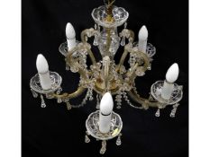 A crystal chandelier with gilt fittings, minor fau