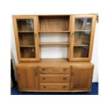 A retro styled Ercol elm wall cabinet with cupboar