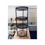 A four tier rustic wrought iron vegetable rack 30i