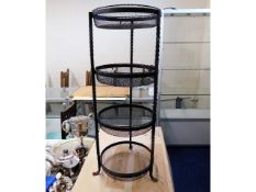 A four tier rustic wrought iron vegetable rack 30i