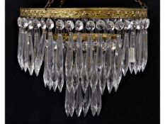 A crystal chandelier with gilt fittings, minor fau