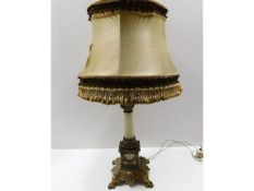 An early 20thC. decorative lamp with ornate gilt f