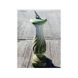 A weathered stone pedestal 40.5in high with bronze