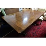 A oak pedestal table with cleated ends, 68.5in lon