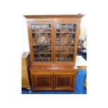 A good antique mahogany bookcase with bevelled gla