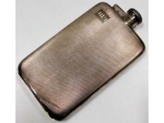 A large silver hip flask approx. 7.5in tall, 323.5