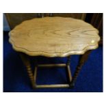 An oak barley twist occasional table with scallope