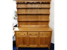 An Ercol elm farmhouse dresser, 75in high x 58in w