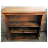 A low level oak bookcase, 36.25in wide x 35.375in