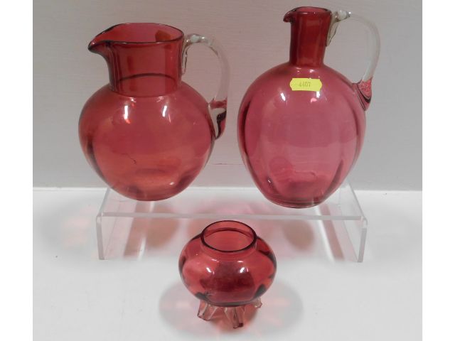 Three pieces of Victorian cranberry glass, tallest
