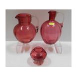 Three pieces of Victorian cranberry glass, tallest