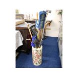 A stick stand, 19.25in high x 9in diameter plus co